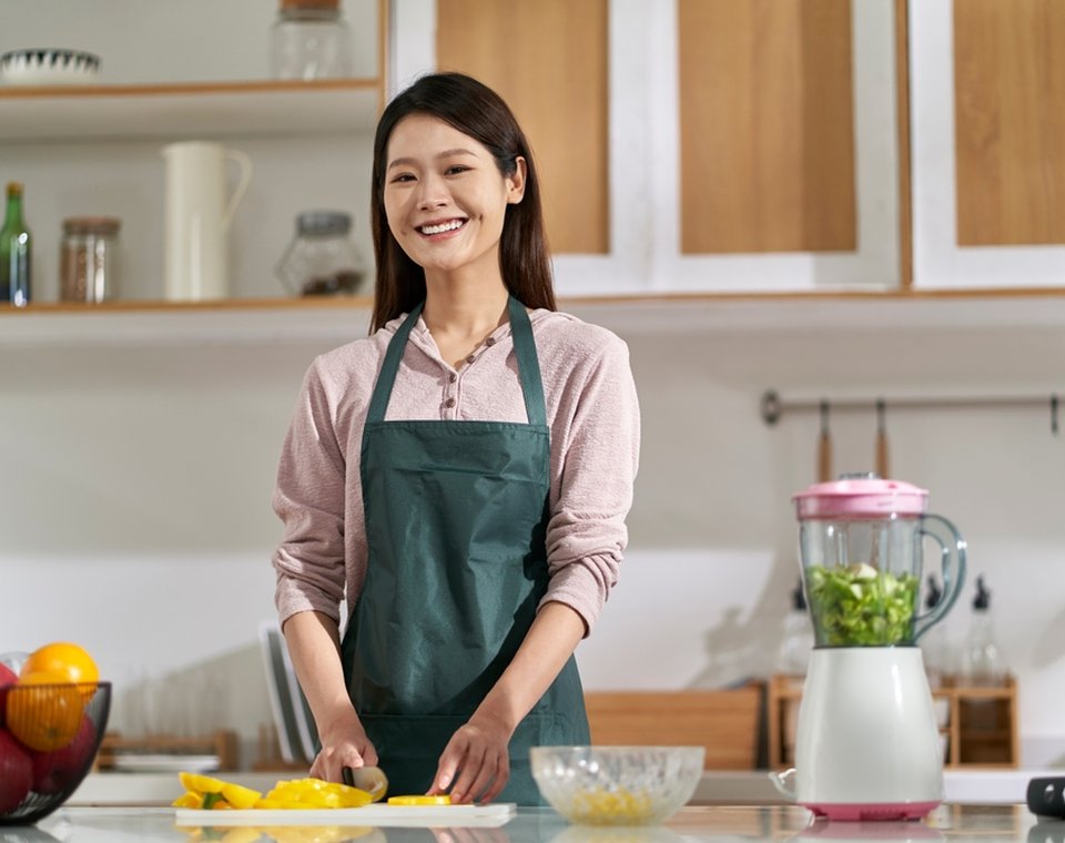 woman-preparing-fresh-fruit-vegetables-kitchen